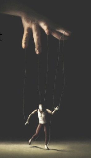 A hand is manipulating a human-like marionette puppet with strings attached to its arms and legs. The background is dark, and the puppet appears to be lifelessly hanging and slightly tilted to one side.